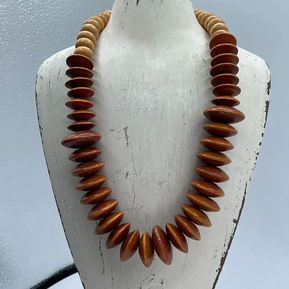 Vintage chunky handcrafted terracotta colored bi-cone wood beaded necklace.